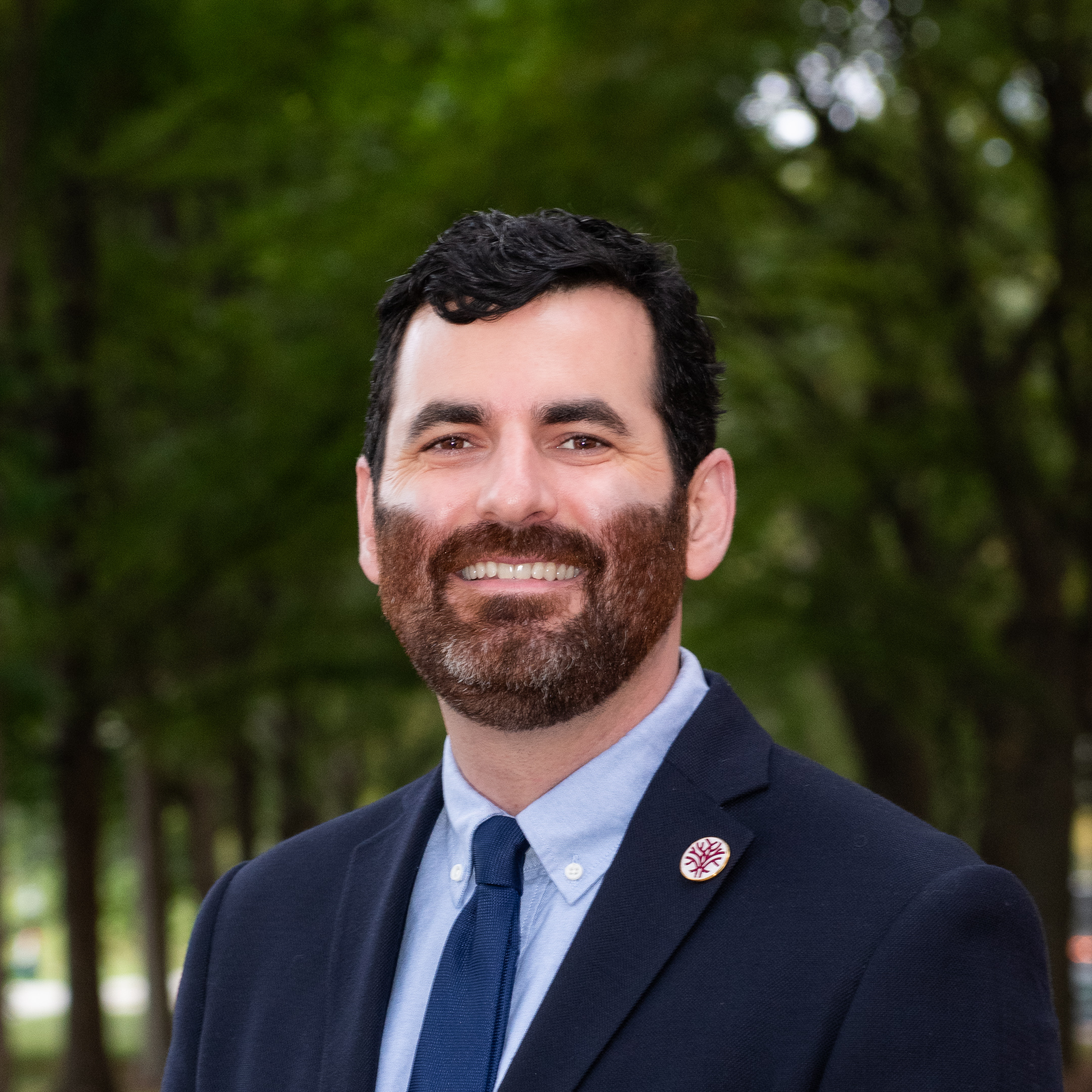 Headshot Openlands VP of Land Management with trees in the background