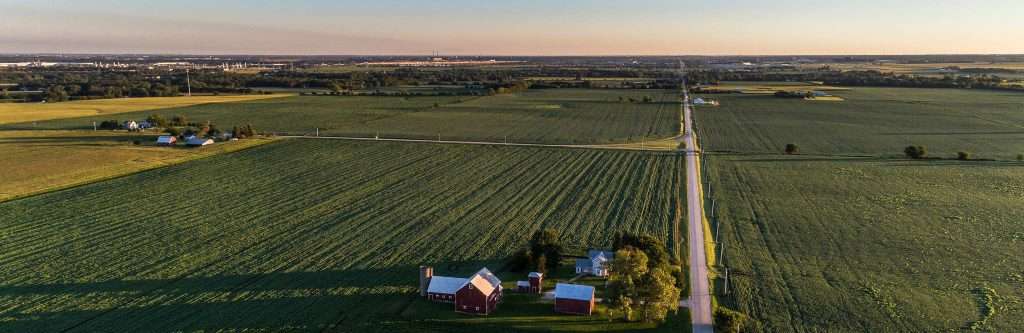 an aerial view of a farm in the countryside