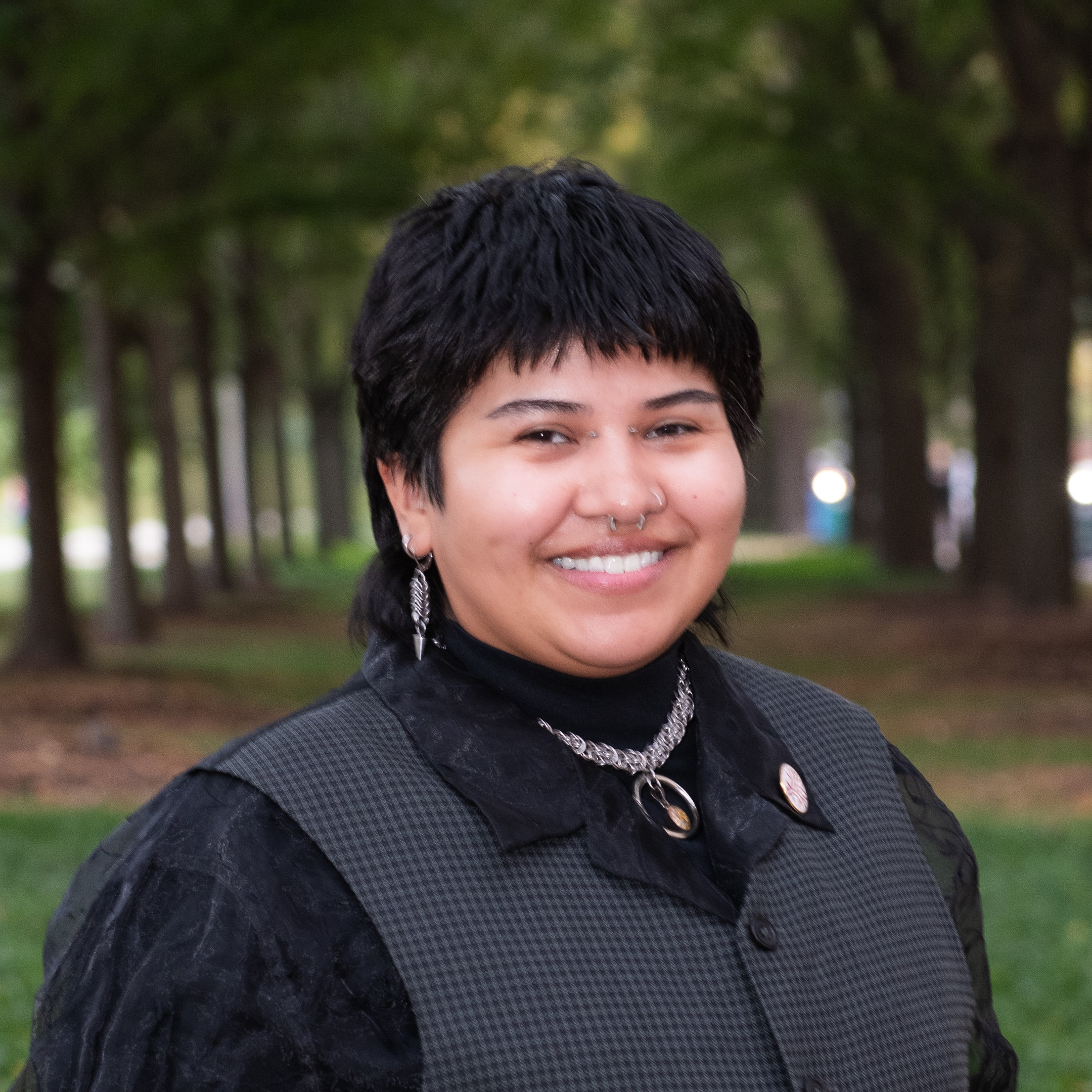 Headshot Openlands Restoration Coordinator with trees in the background