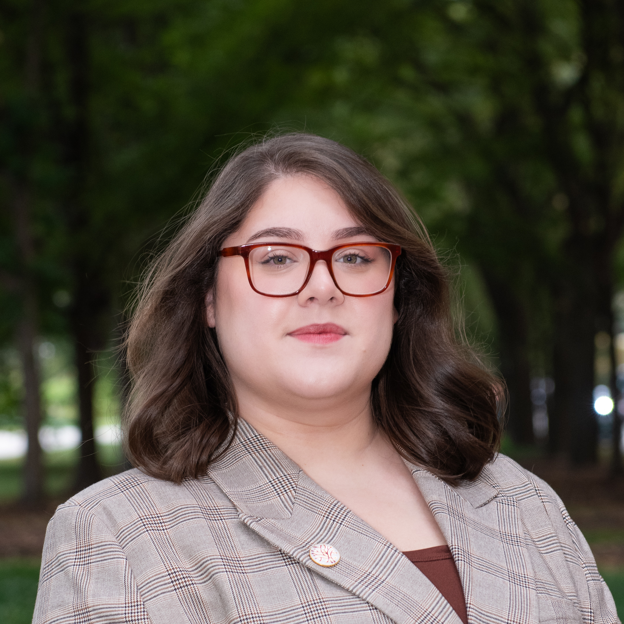 Headshot Openlands Development & Data Associate Rebecca Tobar trees in the background