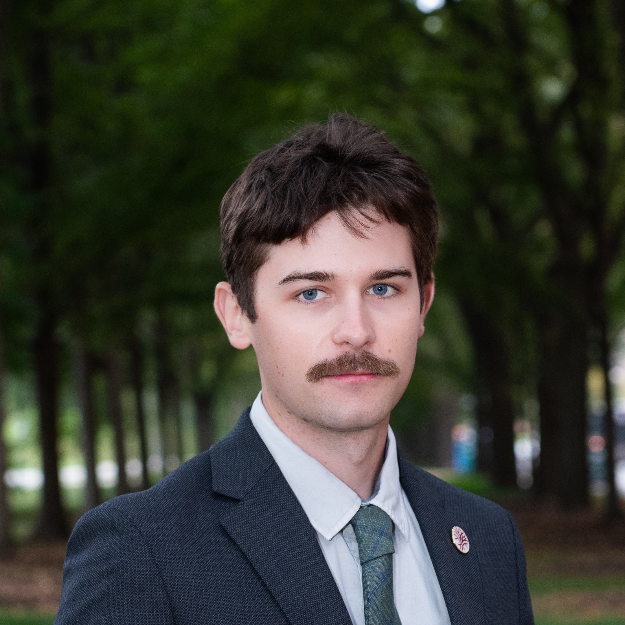 Headshot of Openlands Forestry Specialist Pete Zubek with trees in the background