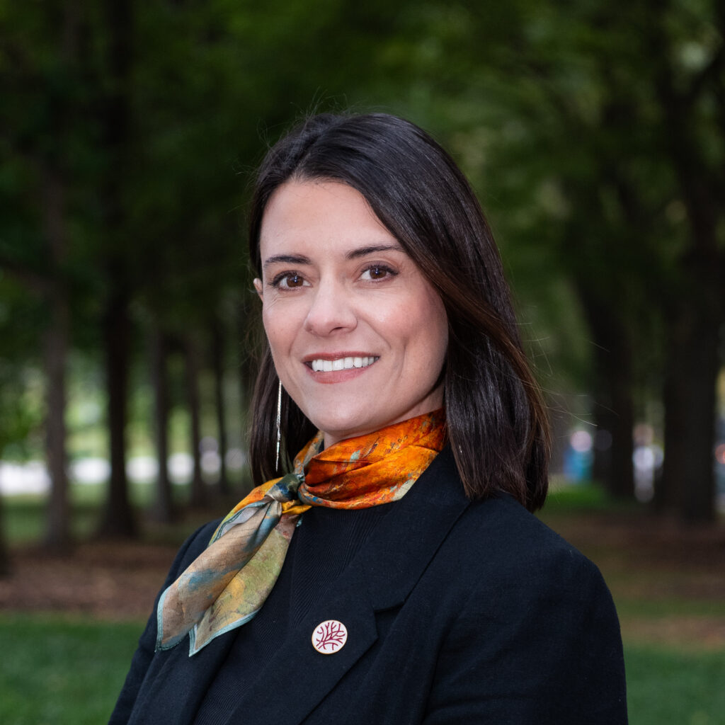 Headshot Openlands Director of Conservation Planning Specialist Sara Egan with trees in the background