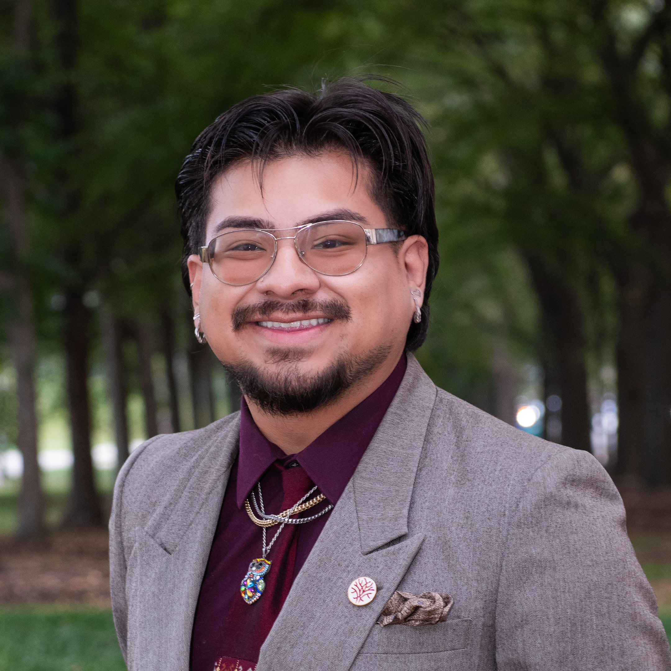 Headshot Openlands Forestry Program Specialist Johan Martinez with trees in the background