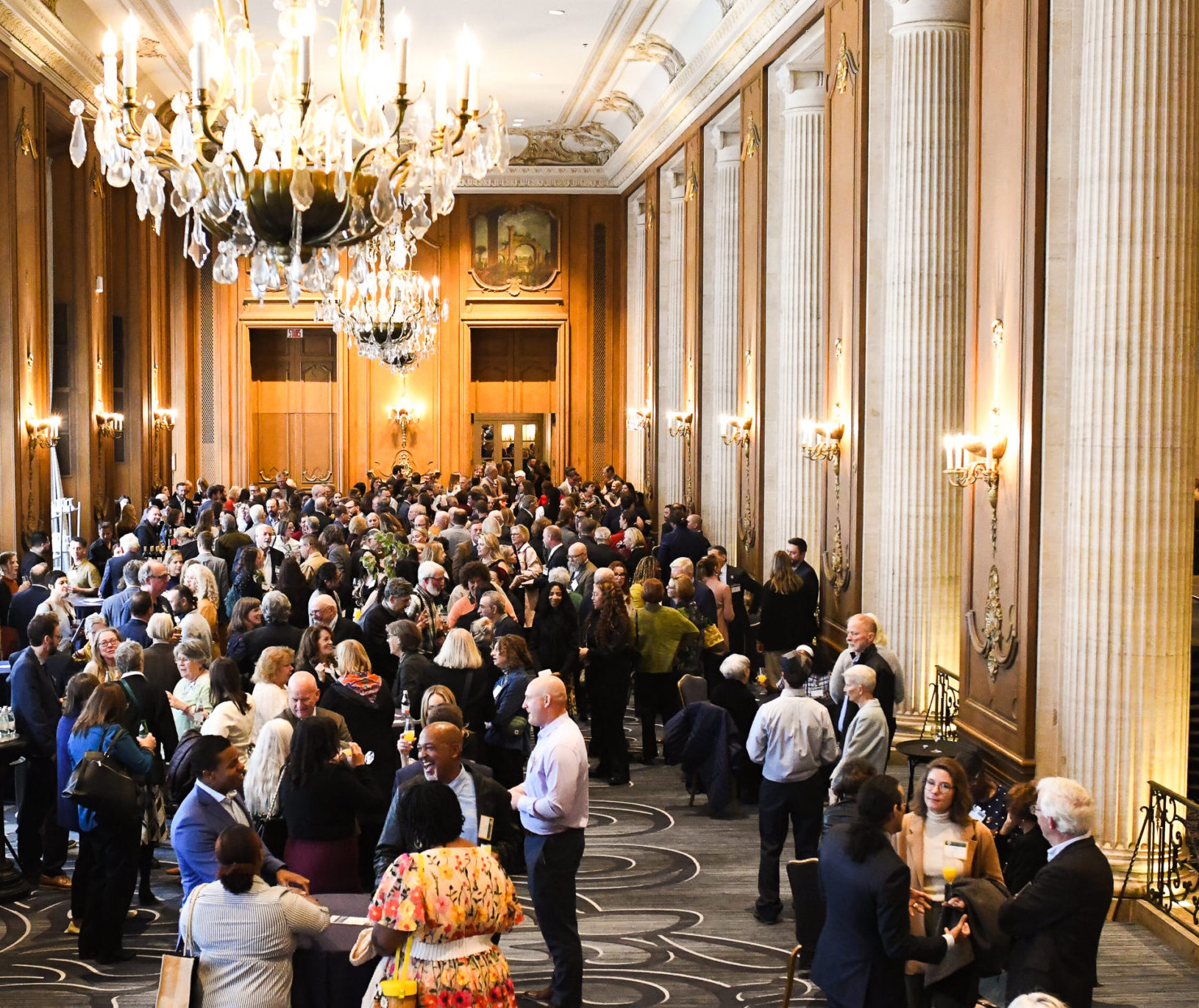 A hall full of people networking at the Openlands Luncheon.