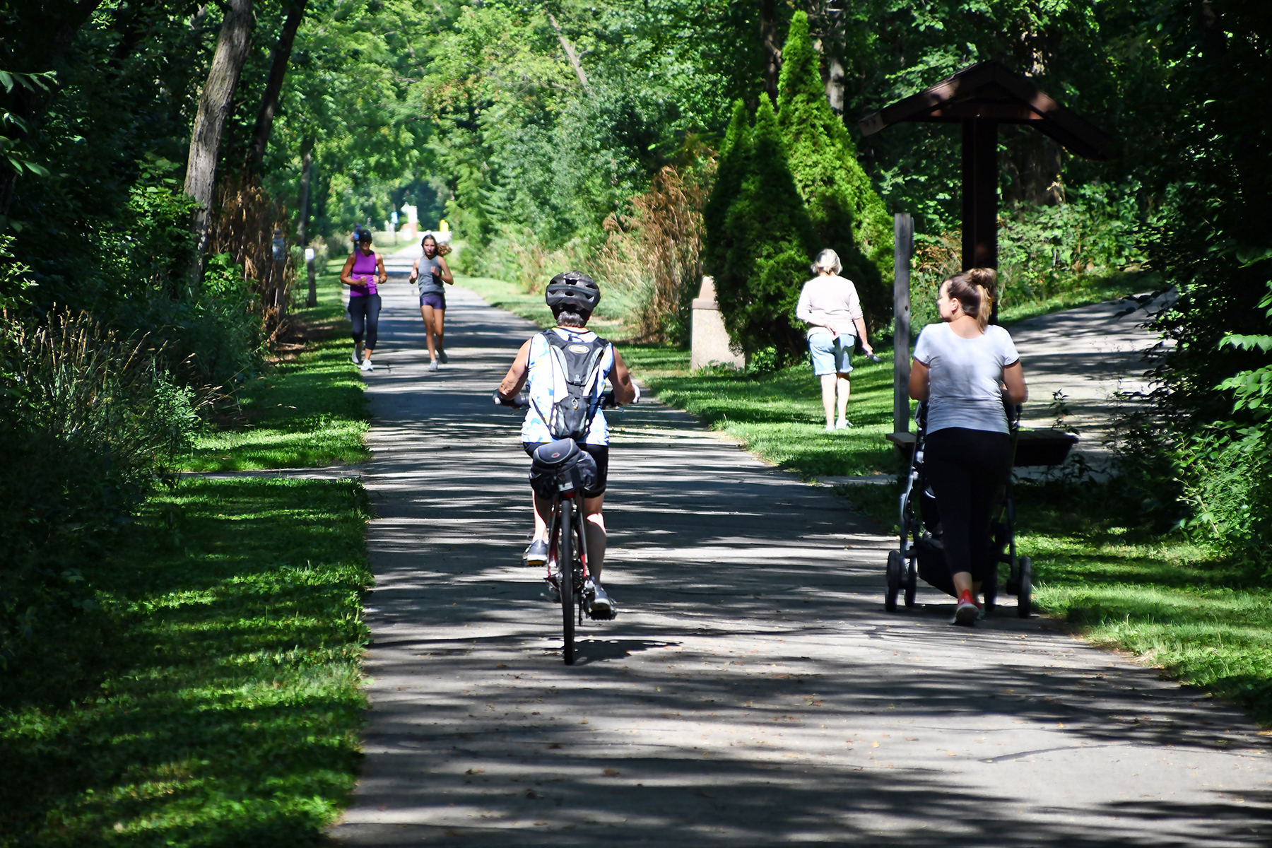 Biker and walker on path