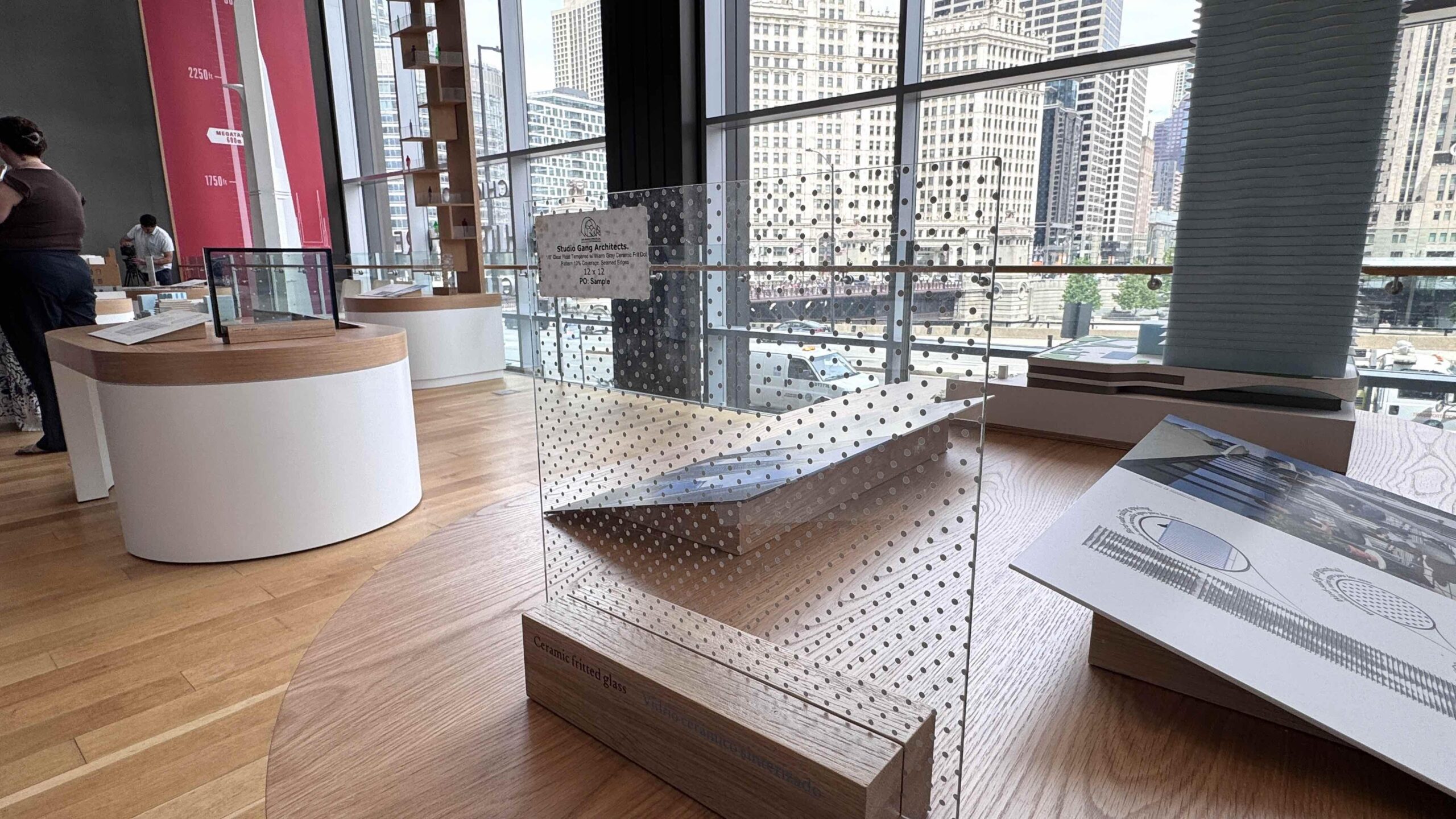 Glass window with white dots designed to be seen by birds shown in exhibit